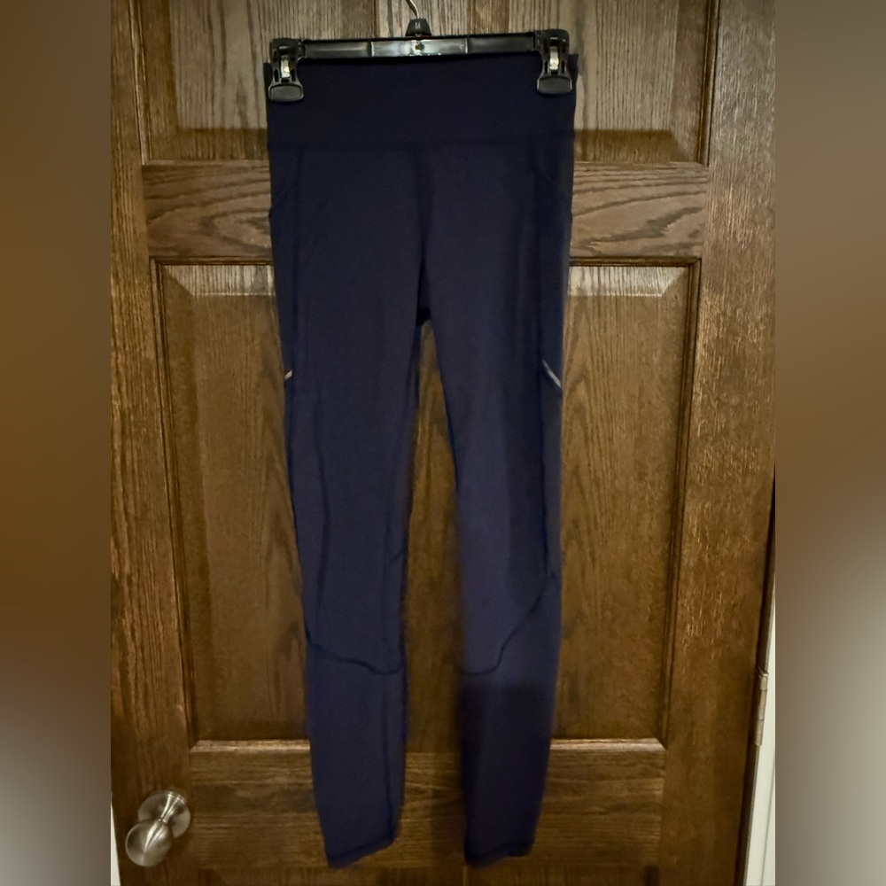 Navy lululemon leggings with mesh drop in pockets size 4.
